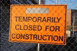 esquire-recruiting-what-to-do-when-unemployed Sign saying "temporarily closed for construction" as symbol for personal growth during unemployment